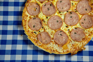 Homemade cheese and loin pizza