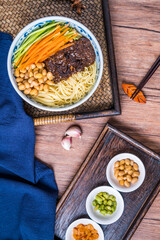 Beijing food old Beijing fried sauce noodles placed on wooden table