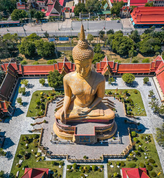 Aerial view of Wat Pikul Thong Phra Aram Luang or Wat Luang Por Pae temple with giant Buddha, in Sing Buri, Thailand