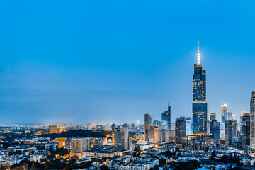 Fototapeta na wymiar Night view of Zifeng Tower and city skyline in Nanjing, Jiangsu, China