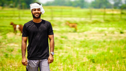 indian young farmer handsome boy with his land in village