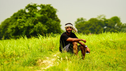 Naklejka na ściany i meble happy young farmer indian image