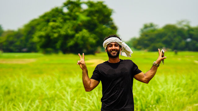 happy young farmer indian image