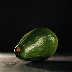 avocado fruit on a dark background, macro, square format