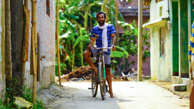 young villager man with bicycle farmer labor boy image