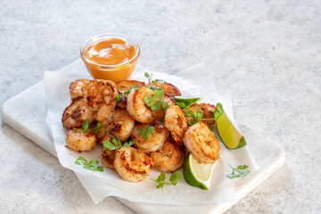 Prawns Shrimps roasted with lemon and garlic on white background