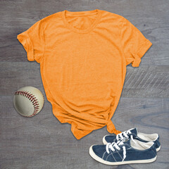 Orange tshirt baseball and shoes still life with room for text or graphics in this shirt mockup.