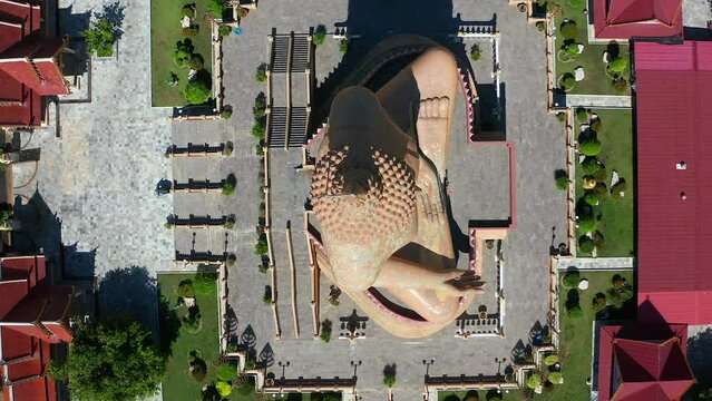 Aerial view of Wat Pikul Thong Phra Aram Luang or Wat Luang Por Pae temple with giant Buddha, in Sing Buri, Thailand