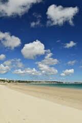 Fototapeta na wymiar St Aubins Bay, Jersey, U.K. Natural beach and stunning sky.