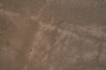 Seamless brown concrete texture. Stone wall background. Surface of the concrete old floor in scratches, which you can use as overlay in your design. High quality photo