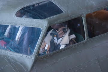 cockpit detail of world war two bomber with dummy pilot