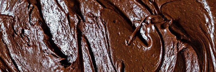 Chocolate texture (mousse) with pieces of chocolate drops. Raw dough for making American brownie dessert, top view.