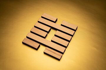 Gene Key 29 hexagram I ching wood on golden background