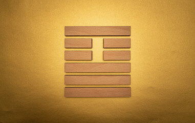 Gene Key 26 hexagram I ching wood on golden background