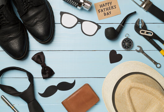 Happy Father's Day inscription with different gifts on wooden background, top view - Powered by Adobe