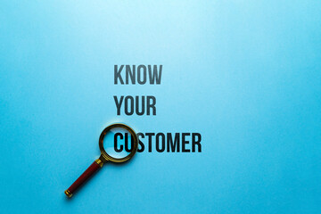 Concept know your customer or KYC. Text on paper under a magnifying glass - obrazy, fototapety, plakaty