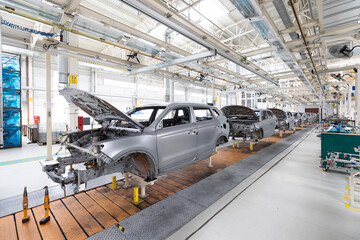 Plant for production of cars. Modern automotive industry. Electric car factory, conveyor