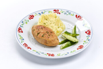 cutlet with mashed potato and cucumber