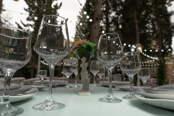 Glasses, fork, knife served for dinner in a restaurant
