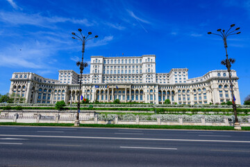 Fototapeta na wymiar The Palace of the Parliament also known as People's House (Casa Popoprului) in Constitutiei Square (Piata Constitutiei) in Bucharest, Romania, in a sunny spring day.