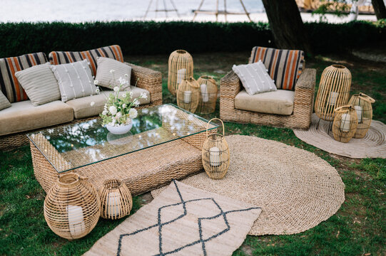 Outdoor Wedding. lounge zone including chairs and tables in boho style
