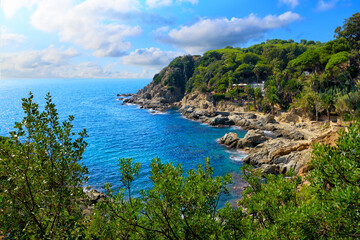 Picturesque view of the Mediterranean Sea and mountains within the city of Lloret de Mar in sunny day. Costa Brava, Girona, Catalonia, Spain