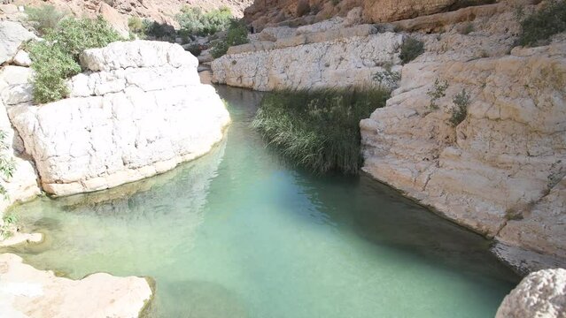 One of the famous natural pool in the canyon of Wadi As Shab, near Wadi Tiwi, a must do activity and idyllic tourist destination. Sultanate of Oman, Middle East, Arabian Peninsula