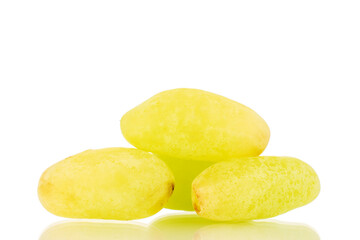 Several berries of white seedless grapes, close-up, isolated on a white background.