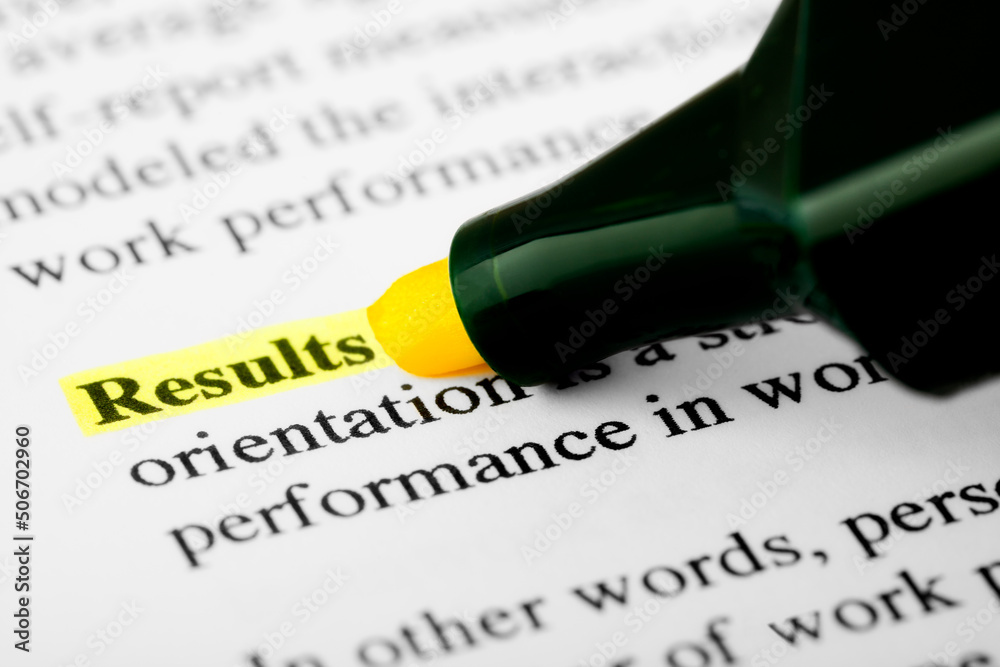 Fototapete results text macro shot highlighted with a highlighter in yellow color on printed paper