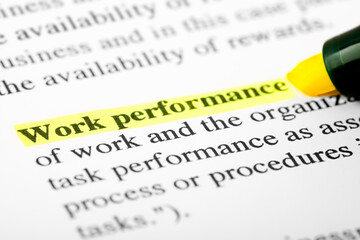 Fototapeta premium Work Performance Text Macro Shot Highlighted with a Highlighter in Yellow Color On Printed Paper