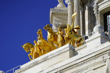 The Quadriga progress of the state. Golden statues to top of Minnesota state Capitol building.