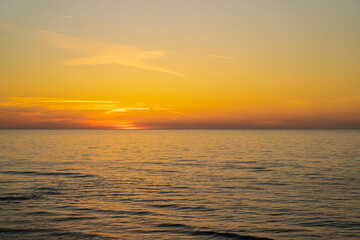 Naklejka na ściany i meble Zachód słońca nad polskim morzem w Rewalu