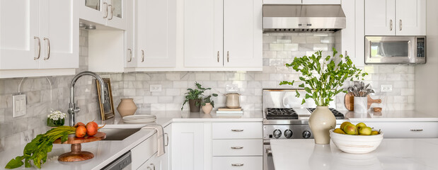 Style Home Still Lifestyle Image. Contemporary Kitchen Design with White Cabinets, Counters, and...
