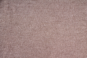 Fototapeta na wymiar knitted fabric is knitted from brown threads