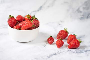Fresh organic strawberries on ceramic table