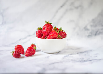 Fresh organic strawberries on ceramic table