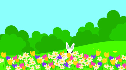 Rabbit sits on a lawn in flowers