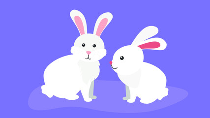 Two white rabbits are sitting