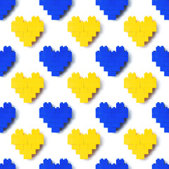 Hearts from blocks as background, seamless pattern from plastic blocks blue and yellow color, shapes heart from child construction. Top view repeat print, Toys and games - obrazy, fototapety, plakaty