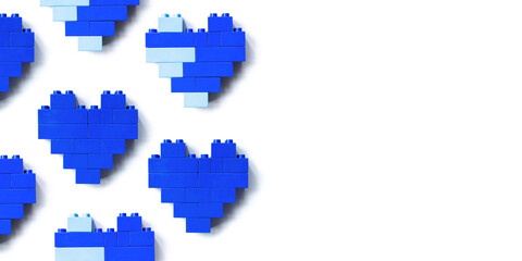 Blue hearts from blocks isolated on white background, geometric pattern from bricks, shapes heart from child construction. Wallpaper of plastic blocks, top view repeat banner