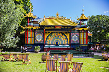 Fototapeta na wymiar Chill out area in Tivoli Gardens, Chinese temple in amusement park Tivoli, Copenhagen, Denmark