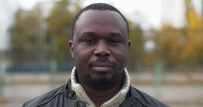 African american man from Nigeria look at the camera, close-up shot. Cinema 4K 60fps video