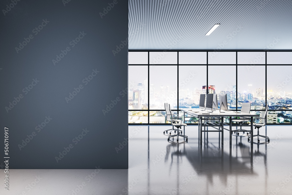 Poster Front view on blank black wall in night open space office with work tables and chairs, modern computers and transparent wall with night city view and street lights. 3D rendering, mock up