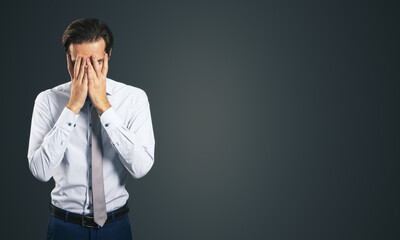 Stress and find solution concept with man in white shirt closing his eyes, facepalm isolated on...