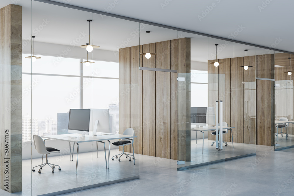 Poster Side view on modern spacious coworking office with wooden wall partitions, modern computers on minimalistic style tables, concrete floor and glass wall instead windows. 3D rendering