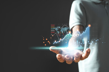 Businessman or trader is showing a growing virtual hologram stock