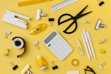 Black and white stationery on yellow background. School stationery supplies. Workplace organization. Concept back to school..