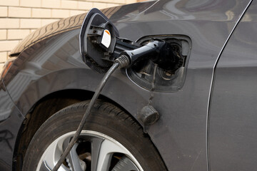 The process of charging an electric car close up