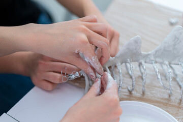 Woman molding and sculpting clay art pieces. Horizontal creative theme poster, greeting cards,...