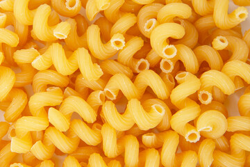 Cavatappi dry pasta organic product background yellow
